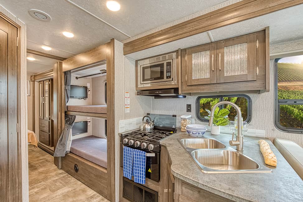 El Monte RV Class A Family Sleeper-Family_Sleeper_AF_Interior_kitchen_bunkbeds